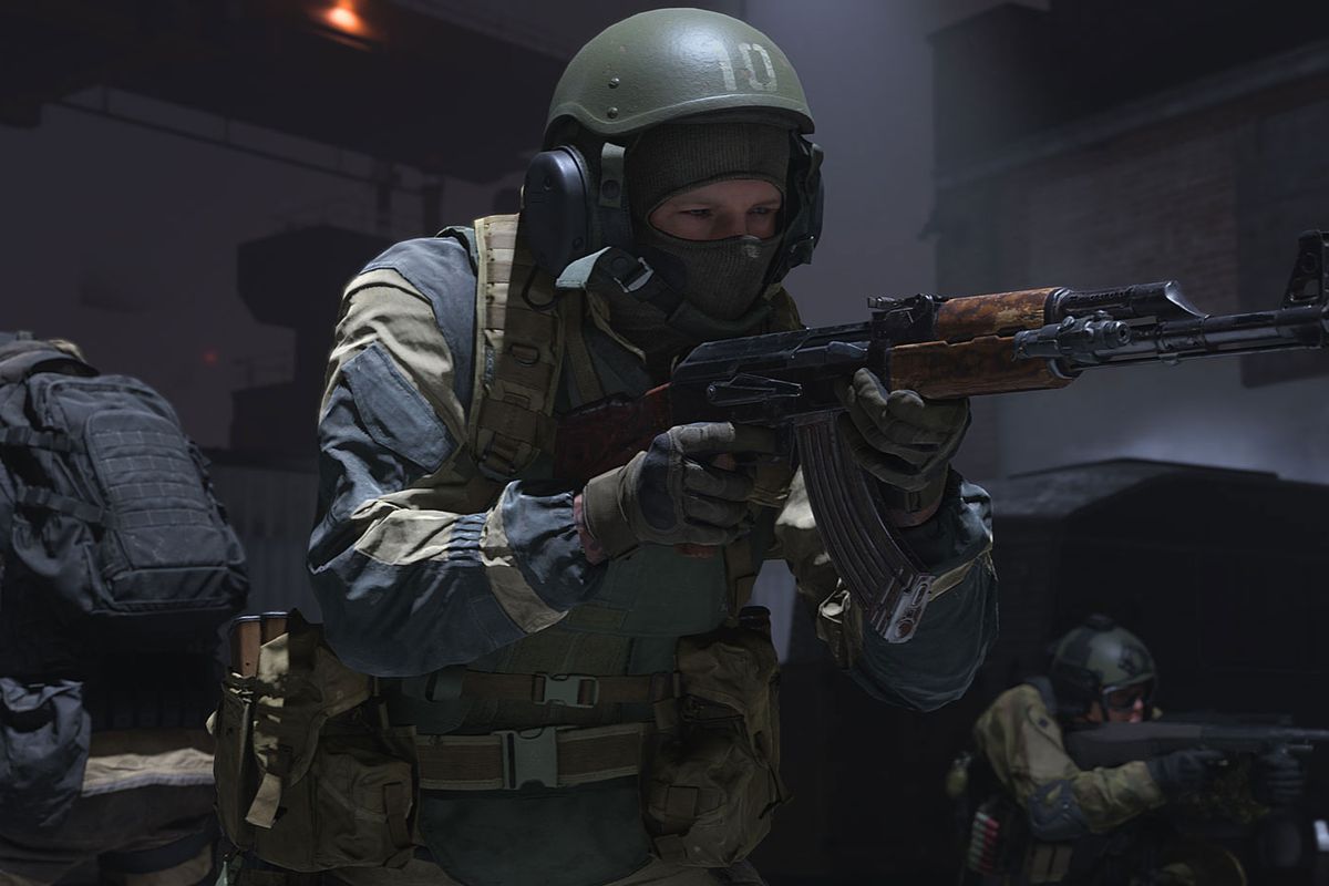 Three soldiers in Russian military gear secure an area in Call of Duty: Modern Warfare.