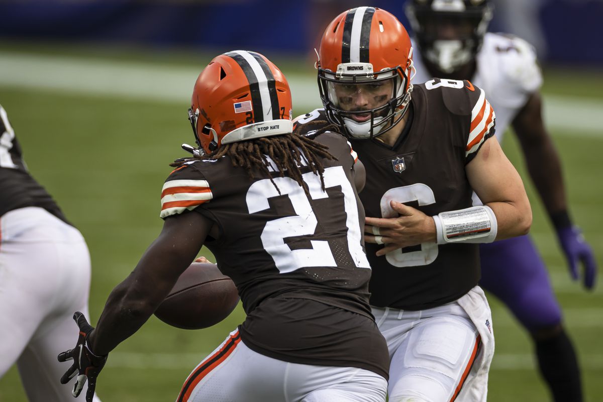 Baker Mayfield #6 of the Cleveland Browns hands the ball off to Kareem Hunt #27 during the second half of the game against the Baltimore Ravens at M&amp;T Bank Stadium on September 13, 2020 in Baltimore, Maryland.
