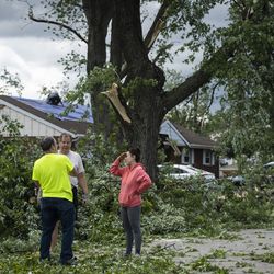 Homes are severely damaged on Chestnut Avenue near Evergreen Lane in Woodridge after a tornado ripped through the western suburbs overnight, Monday morning, June 21, 2021.
