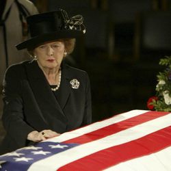 In this June 9, 2004 file photo, former British Prime Minister Margaret Thatcher pauses at the casket of former U.S. President Ronald Reagan where he was lying in state in the Capitol Rotunda on Capitol Hill in Washington. Thatchers former spokesman, Tim Bell, said that the former British Prime Minister Margaret Thatcher died Monday morning, April 8, 2013, of a stroke.  She was 87. (AP Photo/Ron Edmonds, File)