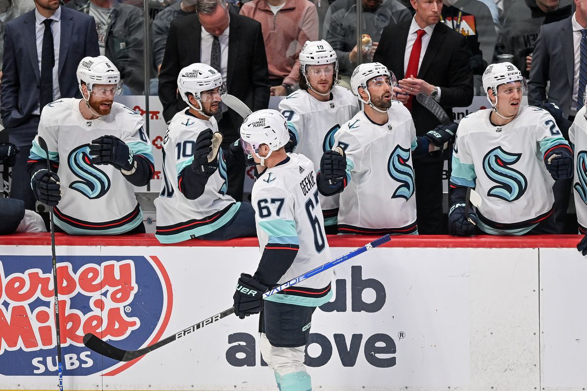 Morgan Geekie of the Seattle Kraken celebrates with teammates on the bench after scoring a goal against the Colorado Avalanche in the third period of Game One in the First Round of the 2023 Stanley Cup Playoffs at Ball Arena on April 18, 2023 in Denver, Colorado.