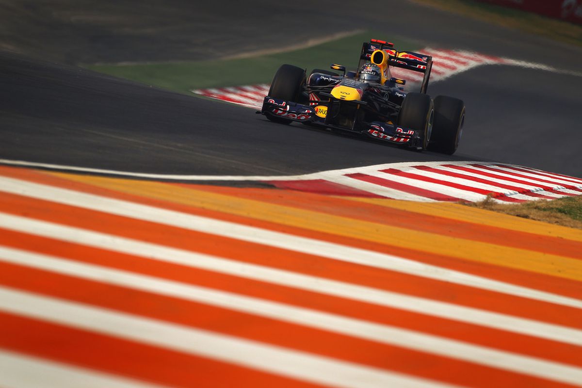NOIDA, INDIA - OCTOBER 30:  Sebastian Vettel of Germany and Red Bull Racing drives during the Indian Formula One Grand Prix at the Buddh International Circuit on October 30, 2011 in Noida, India.  (Photo by Clive Mason/Getty Images)