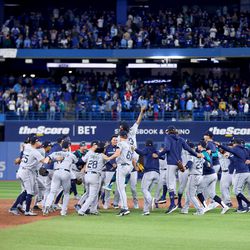 OCTOBER 08: The Seattle Mariners celebrate after defeating the Toronto Blue Jays in game two to win the American League Wild Card Series at Rogers Centre on October 08, 2022 in Toronto, Ontario. The Seattle Mariners defeated the Toronto Blue Jays with a score of 10 to 9.