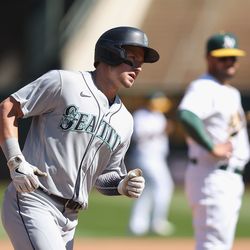 OAKLAND, CALIFORNIA - SEPTEMBER 22: Jarred Kelenic #10 of the Seattle Mariners rounds the bases after hitting a solo home run in the top of the fourth inning against the Oakland Athletics at RingCentral Coliseum on September 22, 2022 in Oakland, California.