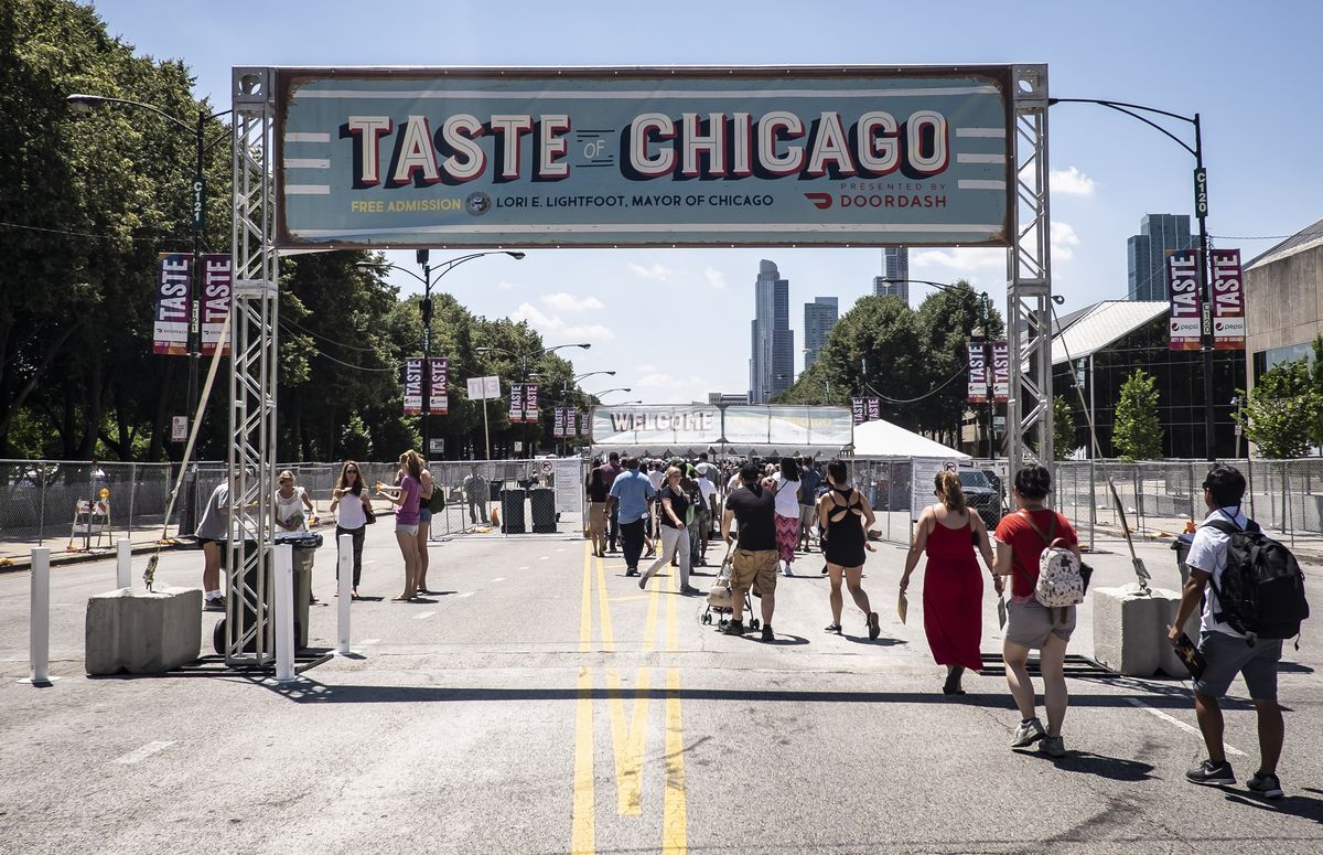 People enter the 2019 Taste of Chicago on Columbus Drive at Monroe Street in July of that year.