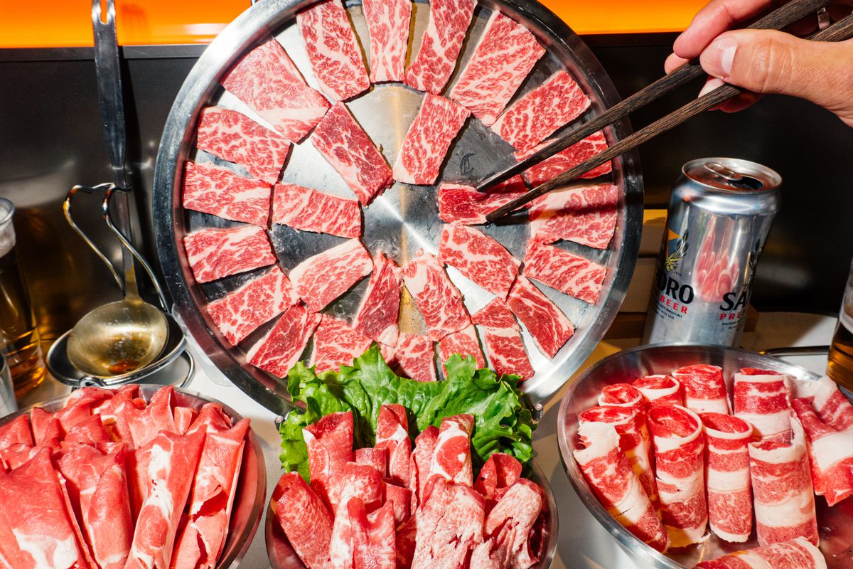 A wheel of marbled beef that’s propped up against a wall seems to defy gravity.
