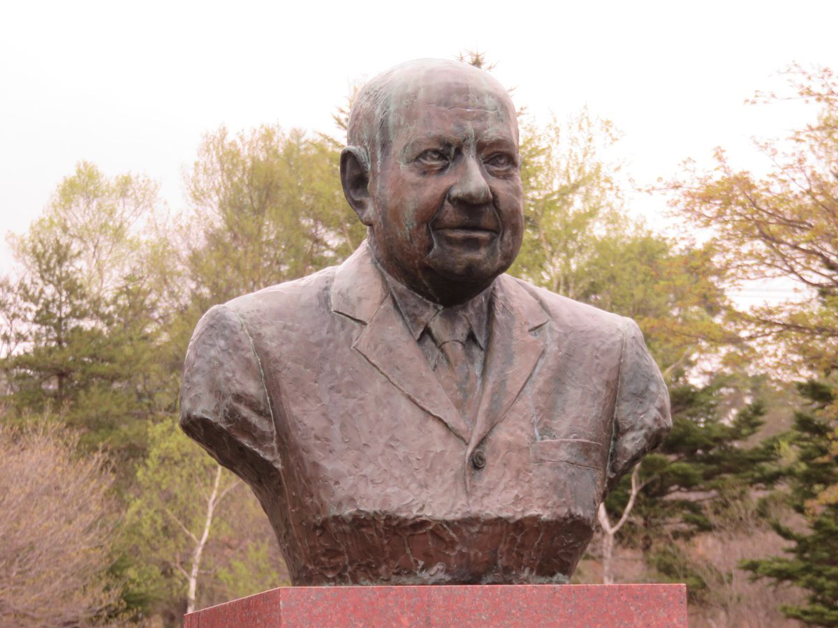 A copper bust statue of Dr. Paul Fredrich Rusch which sits in front of the Paul Rusch Memorial in Hokuto, Yamanashi, Japan.