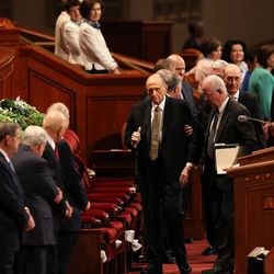 LDS Church President Thomas S. Monson gives a thumbs up to members of the Quorum of the Twelve Apostles as he walks to his seat in the Conference Center in Salt Lake City during the Sunday morning session of the church’s 187th Annual General Conference on Sunday, April 2, 2017.