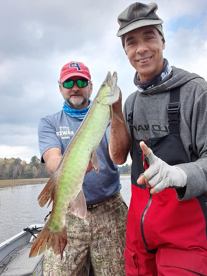 Joe Schatz with his muskie from the Wisconsin River and Rob Abouchar (right). Provided photo