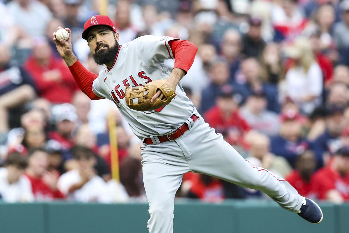 Anthony Rendon of the Los Angeles Angels throws out Cam Gallagher of the Cleveland Guardians at first base during the fifth inning of the game at Progressive Field on May 13, 2023 in Cleveland, Ohio.