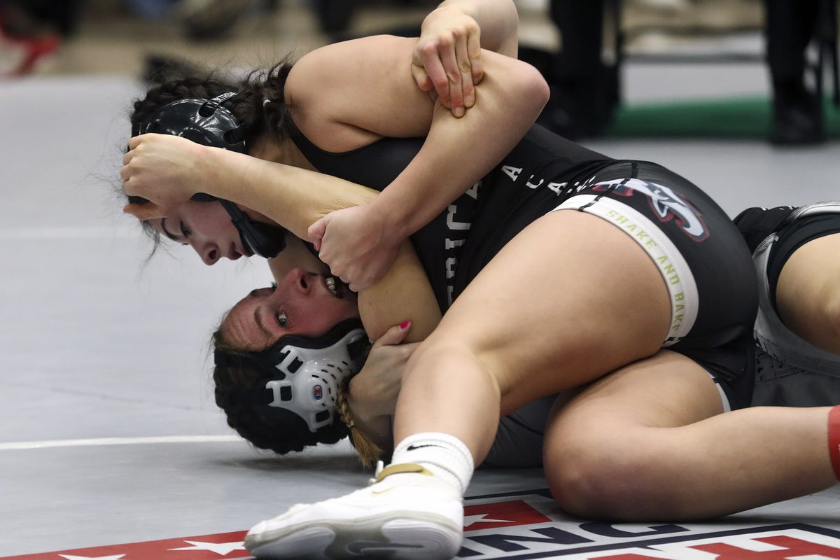 Olivia Carrillo, of the American Leadership Academy, drives Ashlea Larson, of Riverton, to her back during their 145-pound match during the Utah All-Star Duals event at Telos Gymnasium in Orem on Tuesday, Jan. 12, 2021.