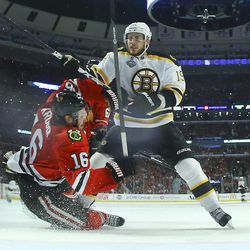 Boston Bruins center Tyler Seguin (19) collides with Chicago Blackhawks center Marcus Kruger (16) in the third period during Game 5 of the NHL hockey Stanley Cup Finals, Saturday, June 22, 2013, in Chicago. (AP Photo/Bruce Bennett, Pool)