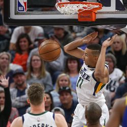 Utah Jazz guard Dante Exum (11) puts the ball in during the game against the Golden State Warriors at Vivint Arena in Salt Lake City on Tuesday, April 10, 2018.