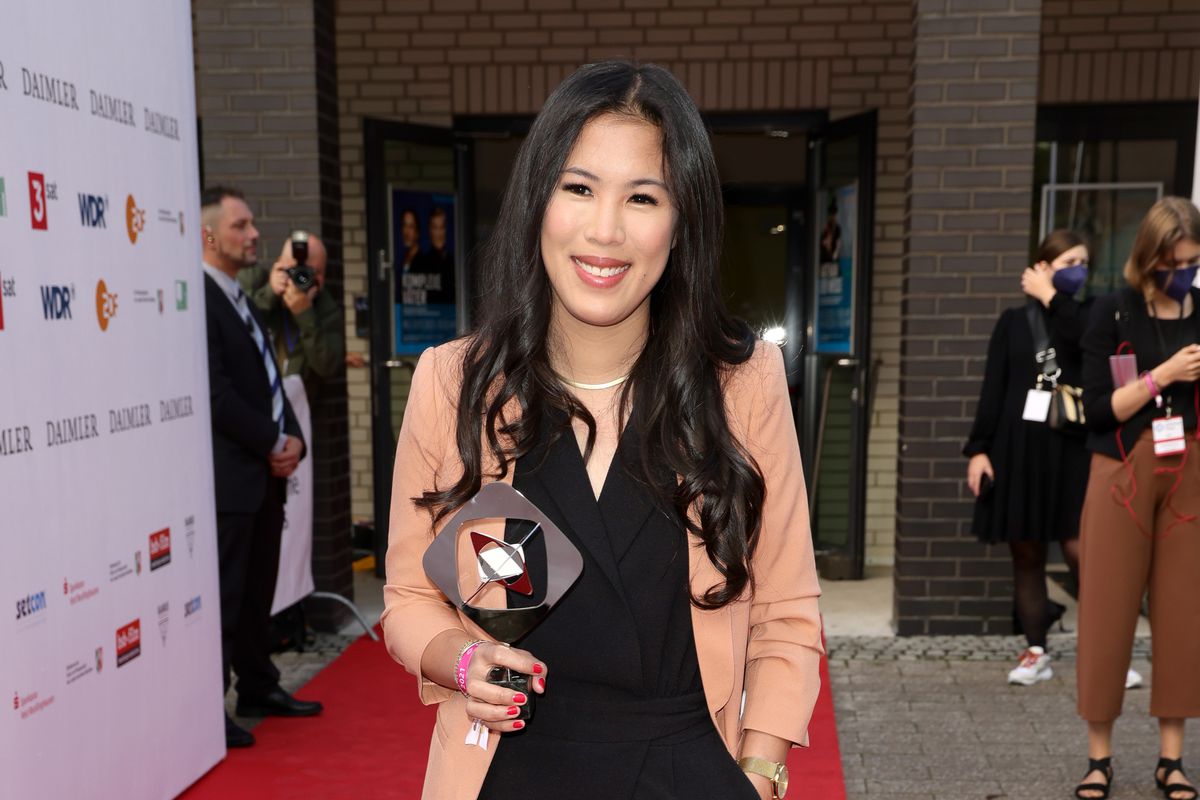 Award winner Mai Thi Nguyen-Kim poses with her trophy as she attends the annual Grimme Award, which is a prestigious German TV awards, which has been called the German TV Oscars