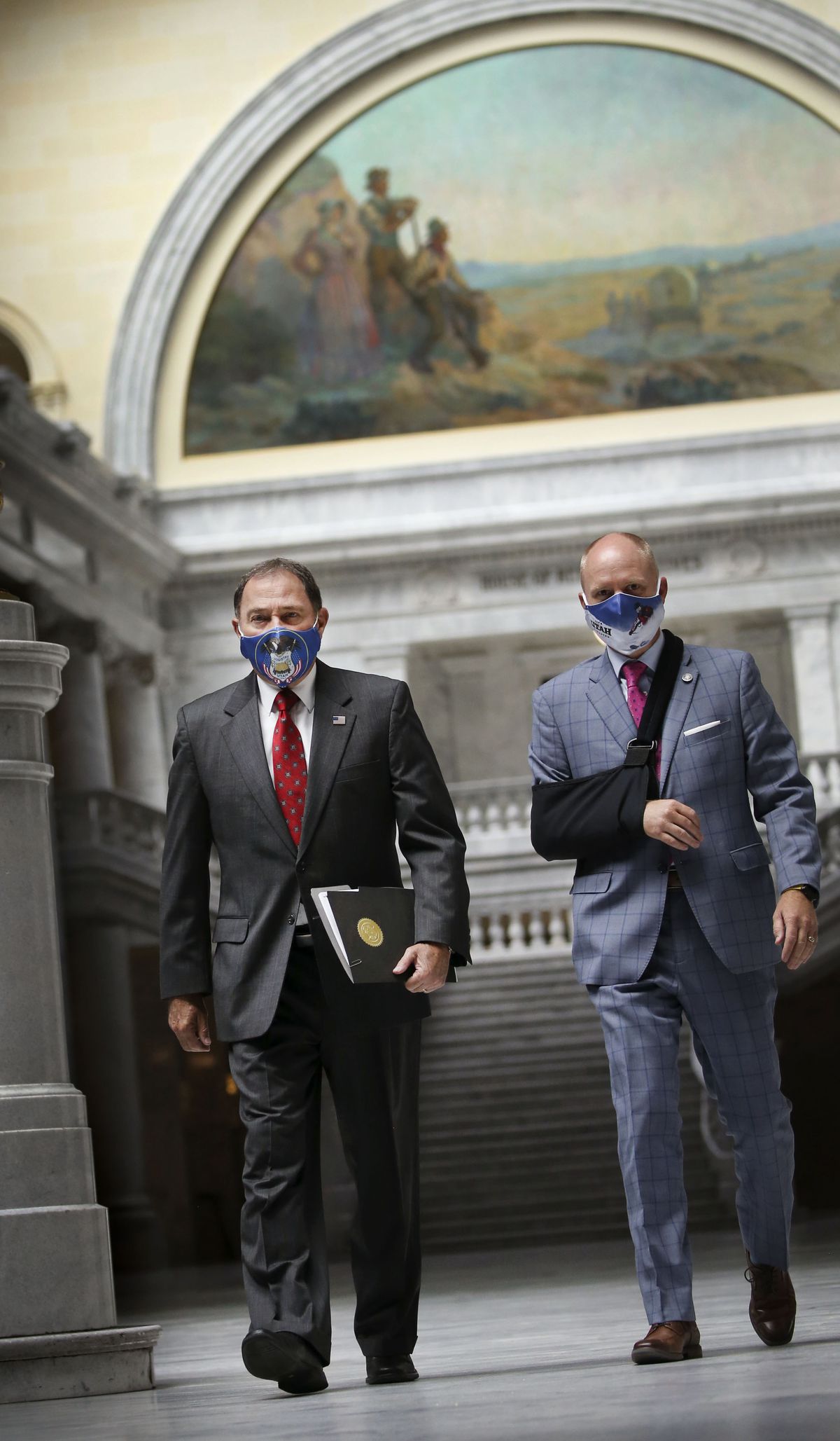 Gov. Gary Herbert and his chief of staff, Justin Harding, walk through the rotunda to a COVID-19 briefing at the Capitol in Salt Lake City on Thursday, July 30, 2020.