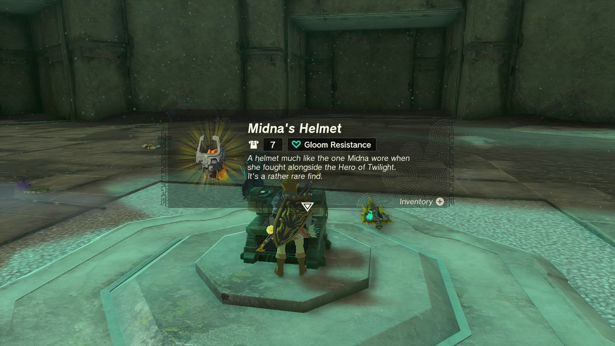 Link stands in front of a chest in Tears of the Kingdom, with an item description popping up on the screen to describe what’s inside: “Midna’s Helmet (Gloom resistance) — A helmet much like the one Midna wore when she fought alongside the Hero of Twilight. It’s a rather rare find.”