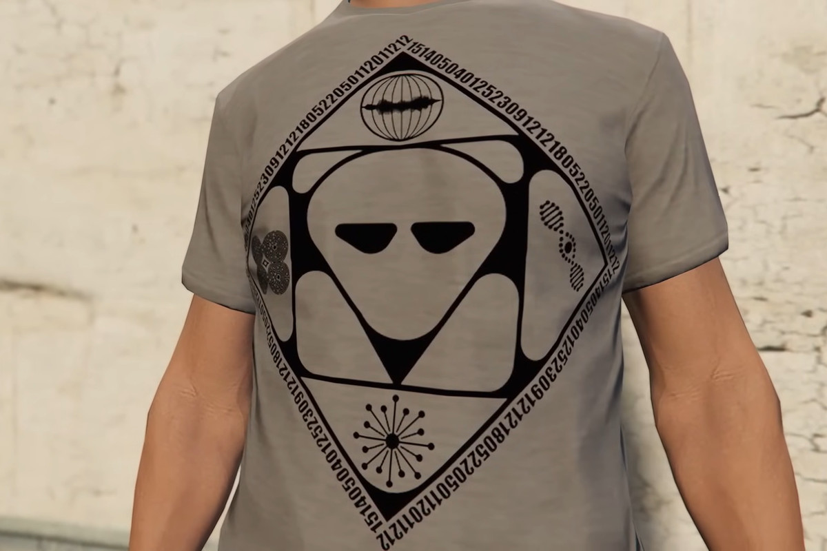 A close-up shot of a gray shirt with an alien pattern from GTA Online