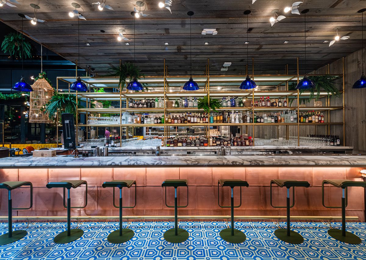 The bar at Ilili features marble and copper detailing.