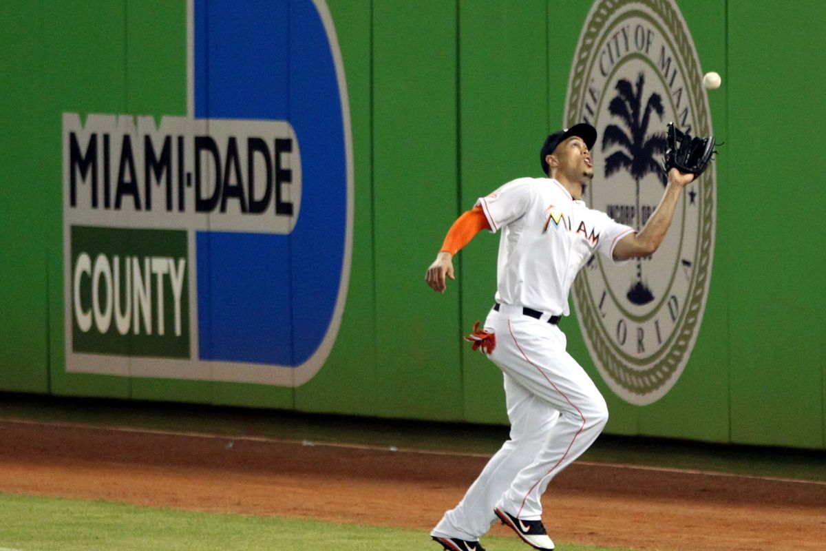 MIAMI, FL - AUGUST 29:  Right fielder Giancarlo Stanton #27 makes a catch against the Washington Nationals at Marlins Park on August 29, 2012 in Miami, Florida.  (Photo by Marc Serota/Getty Images)