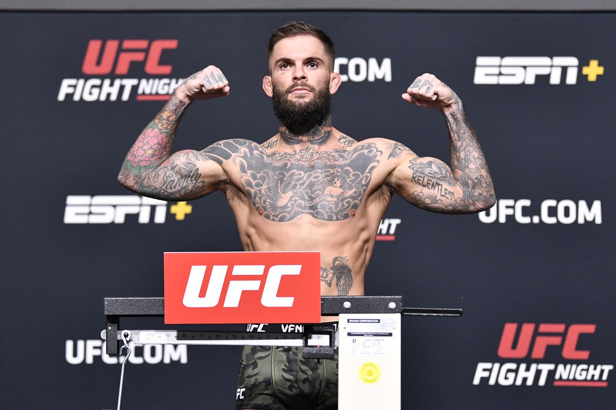 In this UFC handout, Cody Garbrandt poses on the scale during the UFC Fight Night weigh-in at UFC APEX on May 21, 2021 in Las Vegas, Nevada.