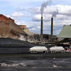 A truck dumps coal at the Huntington power plant in Huntington on Tuesday, March 24, 2015.