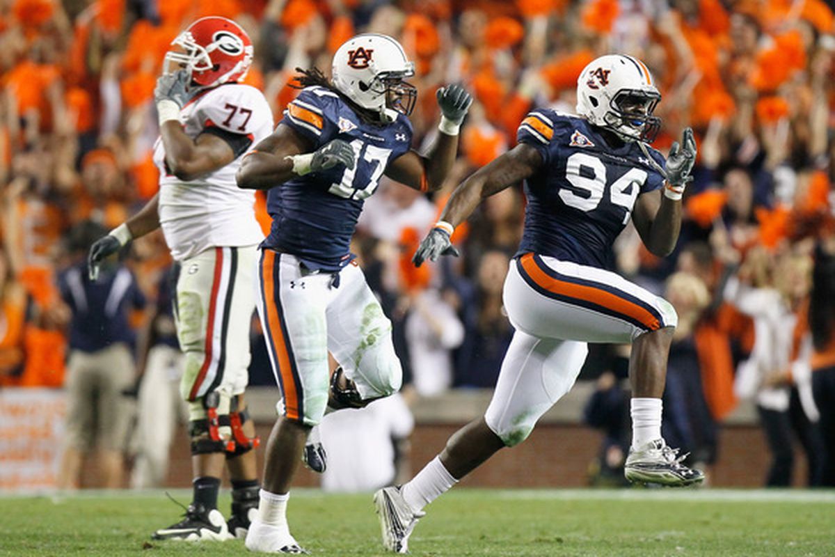 AUBURN AL - NOVEMBER 13:  Nosa Eguae #94 and Josh Bynes #17 of the Auburn Tigers react after a defensive stop of fourth down for the Georgia Bulldogs at Jordan-Hare Stadium on November 13 2010 in Auburn Alabama.  (Photo by Kevin C. Cox/Getty Images)