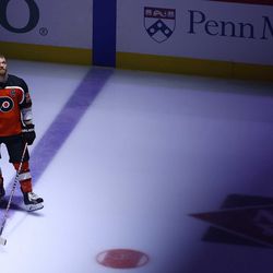 Giroux stands along the blue line prior to the singing of the National Anthem 