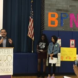 Cook County commissioner Jesus “Chuy” García (left) speaks at a community event organized by Brighton Park Neighborhood Council at James Shields Middle School.