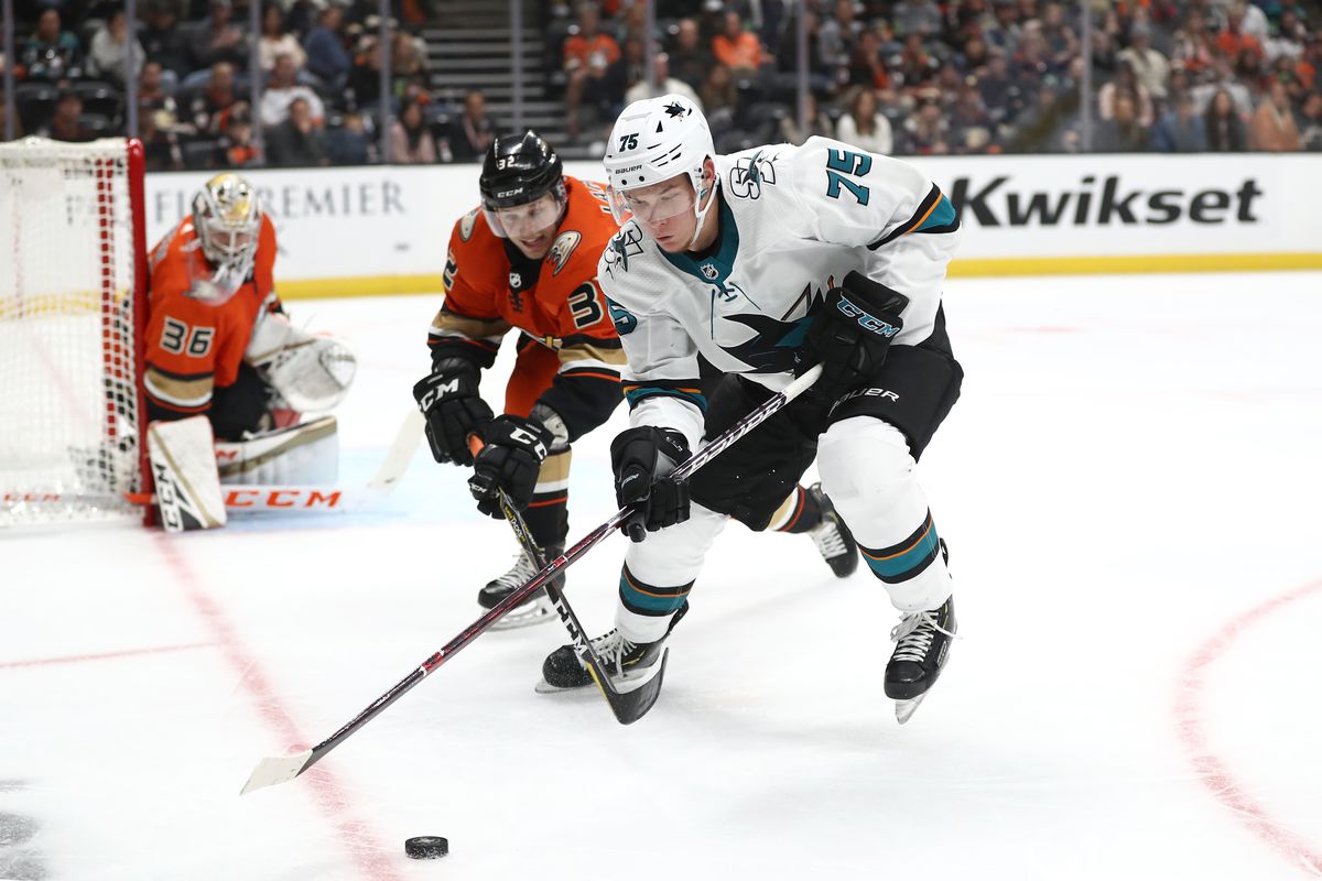 Jacob Larsson #32 of the Anaheim Ducks battles Danil Yurtaykin #75 of the San Jose Sharks for a loose puck during the second period of a game at Honda Center on October 05, 2019 in Anaheim, California.
