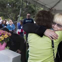 Pam Lancaster, right, embraces her good friend, Susi Felice, during the University of Utah's School of Medicine's Memorial Service honoring those who have dedicated their bodies to advance science and education in the Salt Lake City Cemetery on Friday, May 22, 2015. The women attended the ceremony in honor of Lancaster's mother, Norma Berman, who passed away in March and donated her body to the medical school.