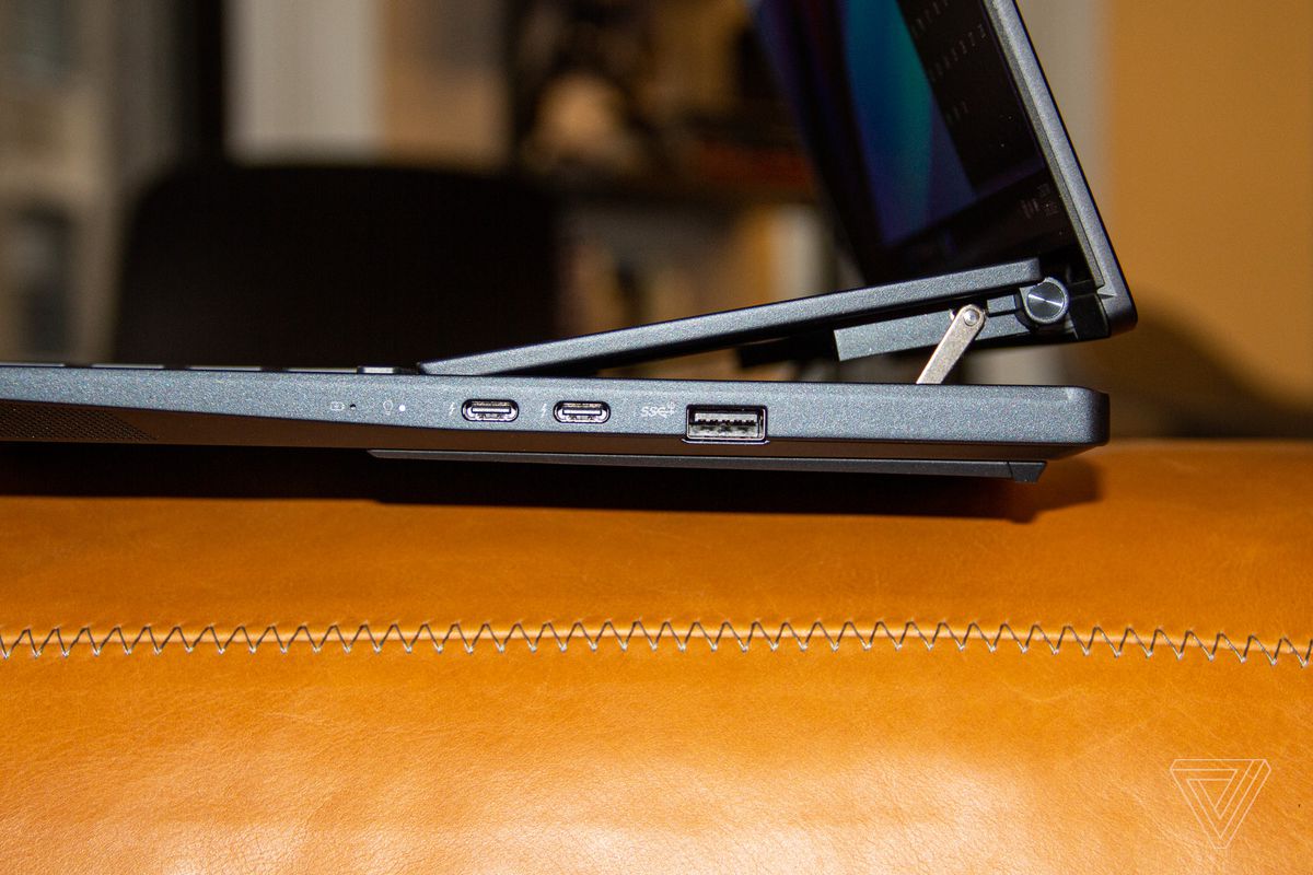 The ports connected  the close    broadside  of the Asus Zenbook Pro Duo 14 OLED.