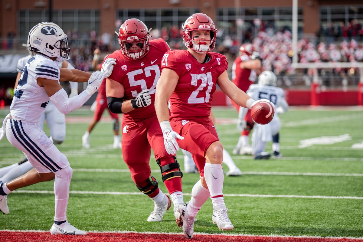 PULLMAN, WA - OCTOBER 23: Washington State running back Max Borghi (21) shuffles into the end zone during the first quarter of a non-conference matchup between the BYU Cougars and the Washington State Cougars on October 23, 2021, at Martin Stadium in Pullman, WA.