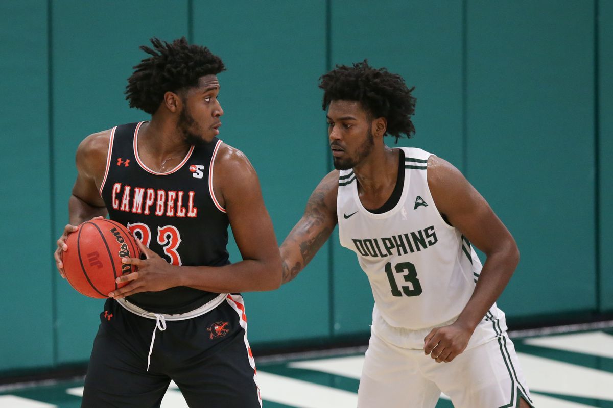 Jacksonville Dolphins forward Bryce Workman guards Campbell Fighting Camels forward Joshua Lusane during the game between the Campbell Fighting Camels and the Jacksonville Dolphins on December 8, 2020 at Swisher Gymnasium in Jacksonville, Fl.