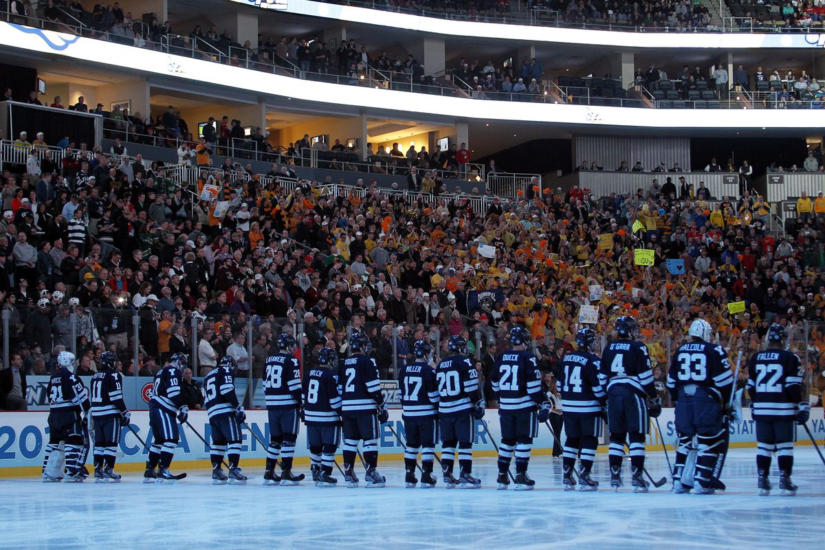 Yale players stand for the introduction of the starting lineups prior to last season's NCAA Championship Game, won by the Bulldogs.
