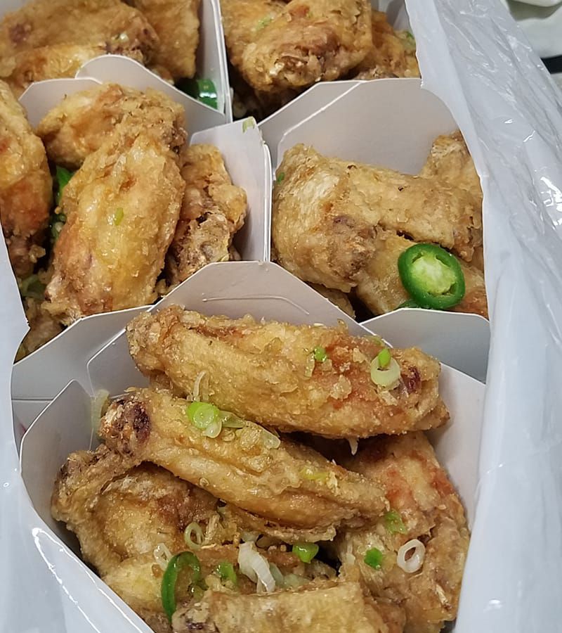 Fried chicken wings packed for takeout at Capital Restaurant