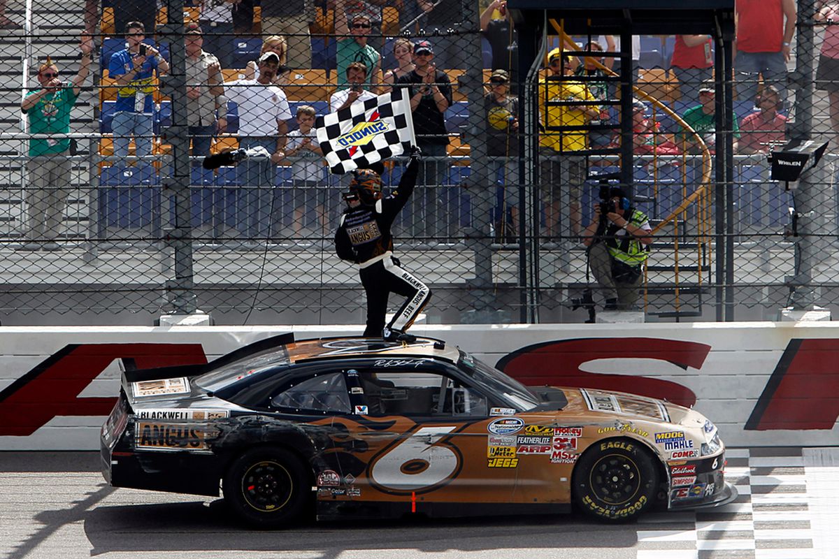 Ricky Stenhouse Jr. celebrates after winning the NASCAR Nationwide Series Inaugural Iowa John Deere Dealers 250 at Iowa Speedway.
