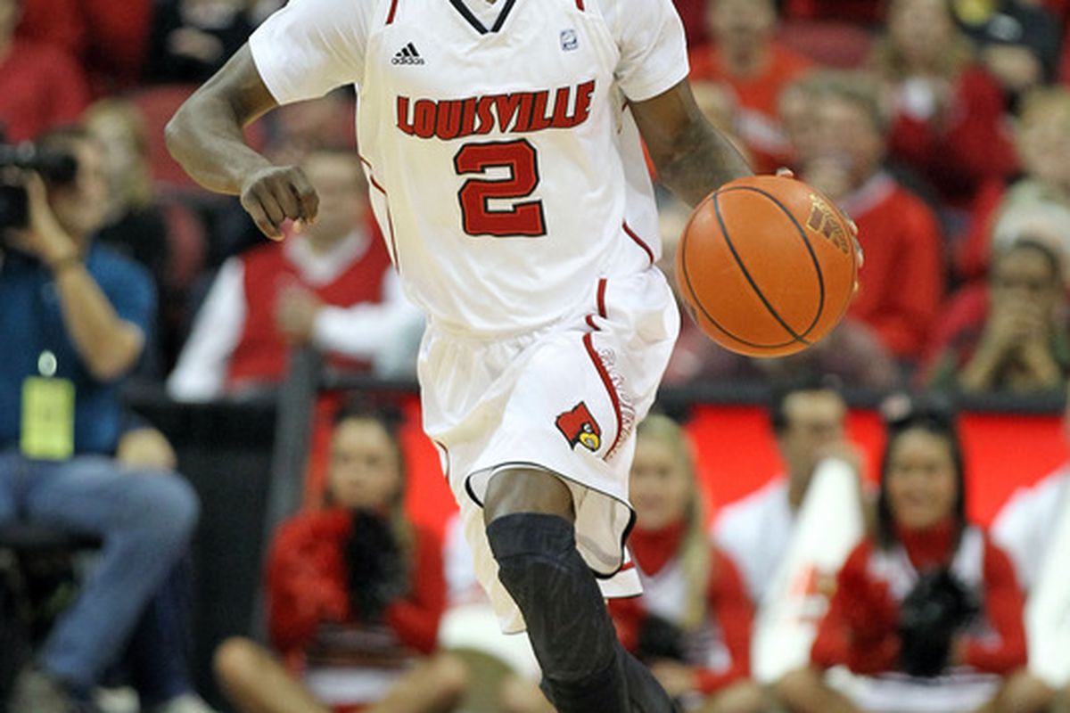 LOUISVILLE, KY - DECEMBER 17:  Russ Smith #2 of the Louisville Cardinals dribbles the ball during the game against the Memphis Tigers  at KFC YUM! Center on December 17, 2011 in Louisville, Kentucky.  (Photo by Andy Lyons/Getty Images)
