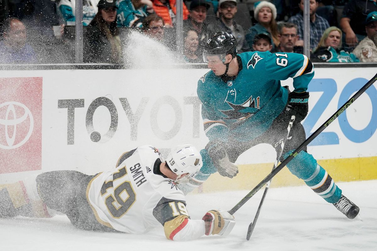 Mar 30, 2019; San Jose, CA, USA; Vegas Golden Knights right wing Reilly Smith (19) slips as San Jose Sharks defenseman Justin Braun (61) gains control of the puck during the second period at SAP Center at San Jose.