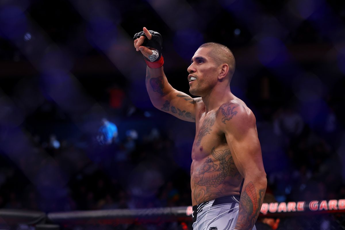 Alex Pereira celebrates after his UFC debut victory over Andreas Michailidis.