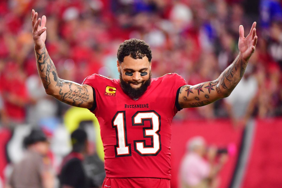 Mike Evans #13 celebrates after the Tampa Bay Buccaneers defeated the Buffalo Bills 33-27 in overtime at Raymond James Stadium on December 12, 2021 in Tampa, Florida.