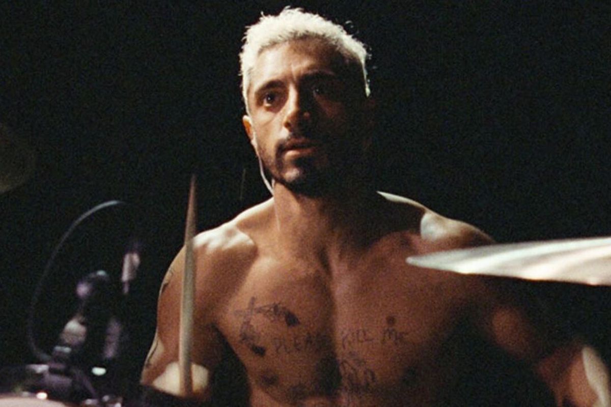 Riz Ahmed shirtless and drumming in Sound of Metal