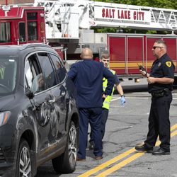Salt Lake police detective Greg Wilking checks on drivers involved in a car accident at 900 South and West Temple in Salt Lake City on Tuesday, May 7, 2019.