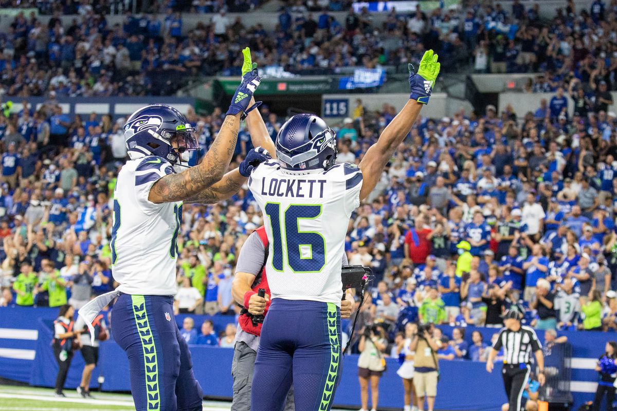 Seattle Seahawks wide receiver Tyler Lockett (16) celebrates his touchdown with teammates in the first quarter against the Indianapolis Colts at Lucas Oil Stadium.