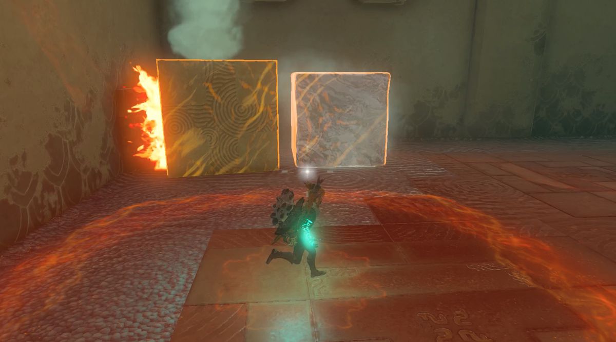 Link blocks fires with a stone cube to save ice in the Tadarok Shrine Fire and Water challenge in Zelda: Tears of the Kingdom