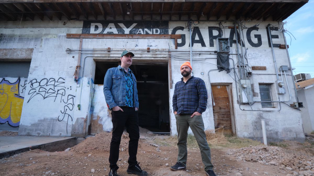 Bret Pfister and Patrick Mannion outside a converted auto garage.