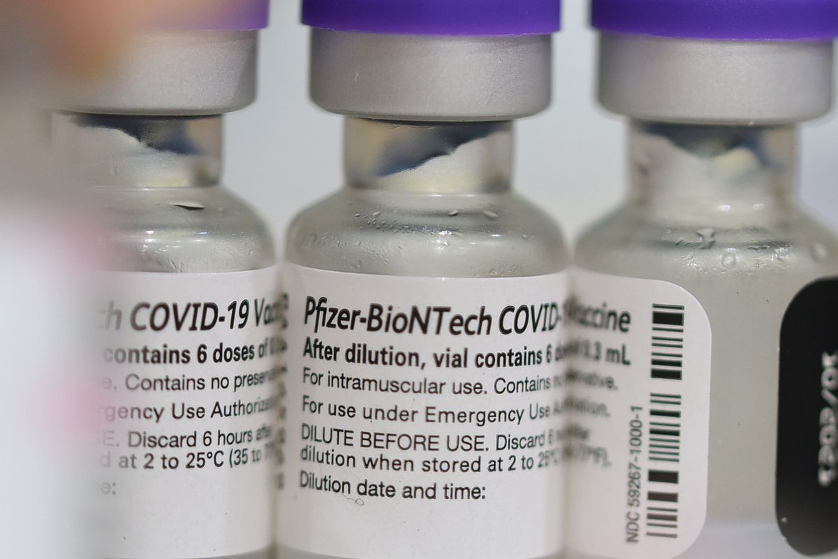 Vials of the Pfizer COVID-19 vaccine are seen at a...