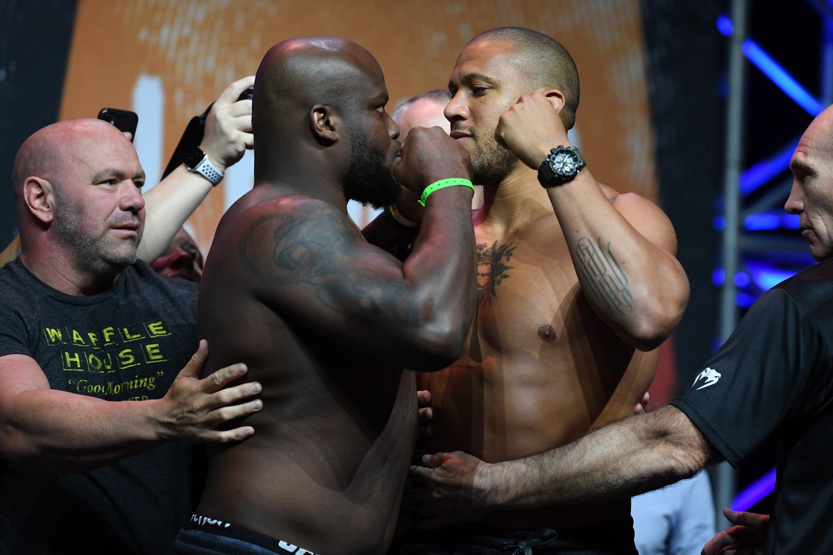 Derrick Lewis and Ciryl Gane face off during the UFC 265 ceremonial weigh-in at Toyota Center on August 06, 2021 in Houston, Texas.