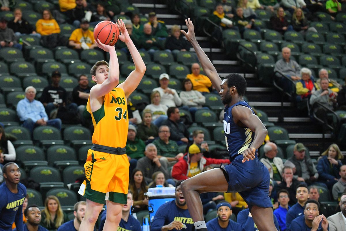 &nbsp;Rocky Kreuser of the North Dakota State Bison shoots against D.J. Weaver of the Oral Roberts Golden Eagles during their game at Scheels Center on February 14, 2019 in Fargo, North Dakota.
