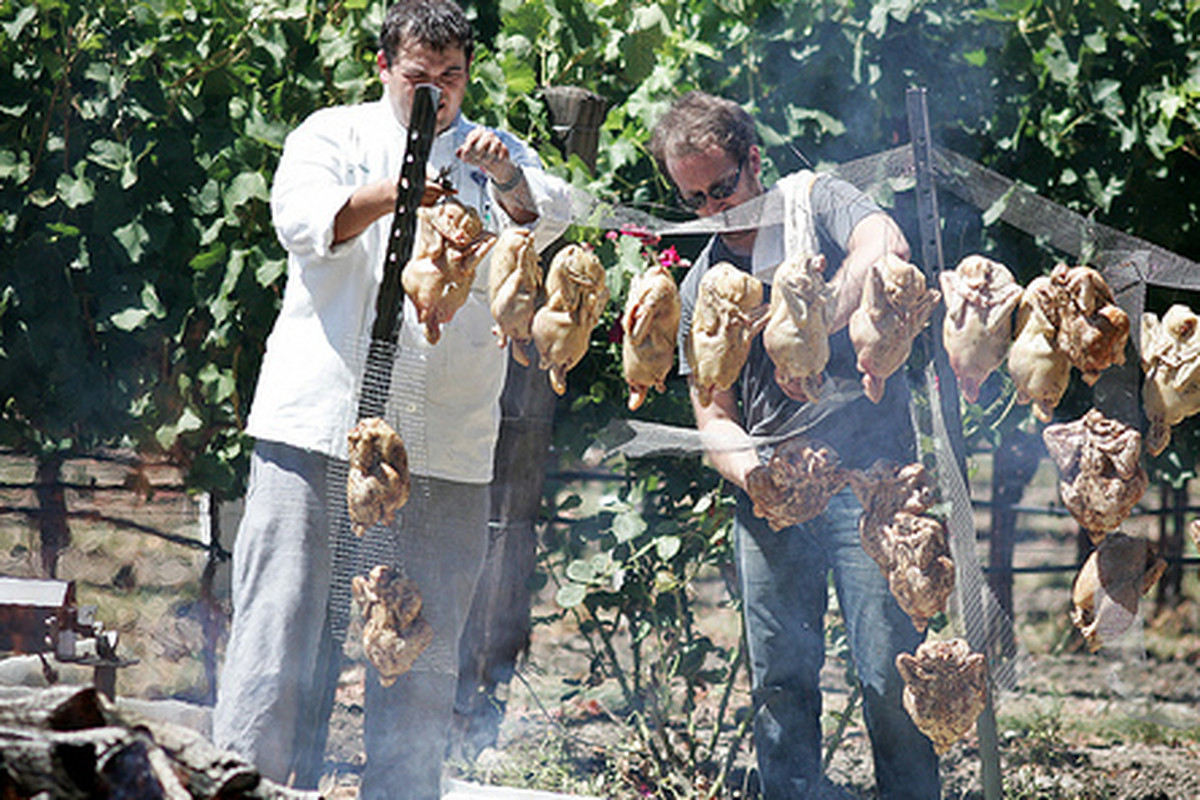 Chefs string up chickens at Heritage Fire. 