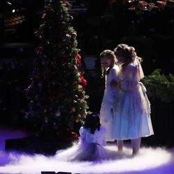 Performers accompany the Tabernacle Choir at Temple Square during their opening Christmas concert in Salt Lake City on Thursday, Dec. 13, 2018.
